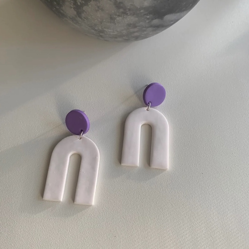 Matte white and purple flat arch dangle earrings